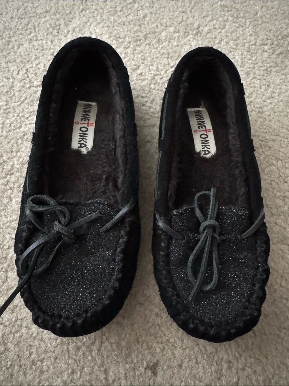 Minnetonka Black Glitter Bow Moccasin Slippers